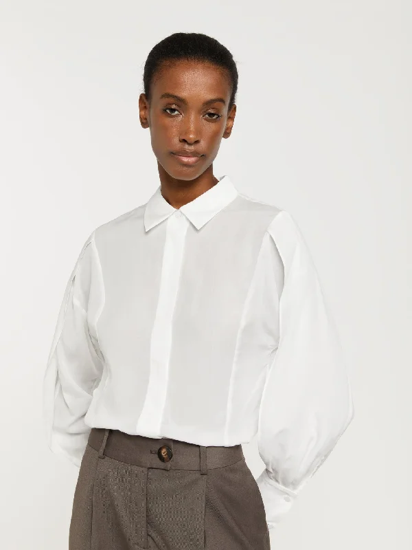 Blouse with sleeve flap