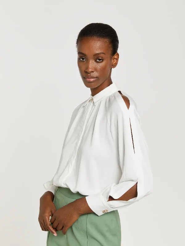 Blouse with sleeves openings